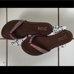 Brash rhinestone flip flops